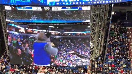Timberwolves mascot "Crunch" sleds down the aisle at Target Center