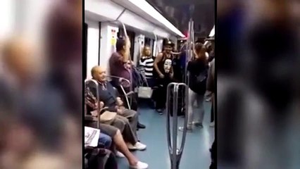 The husband begins to dance with a girl on the train. His wife's reaction is hilarious!