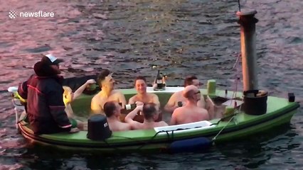 Lads enjoy sub-zero floating champagne jacuzzi