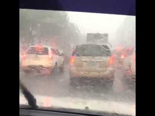 Slow moving traffic along Quezon Avenue bound for Manila due to heavy downpour.