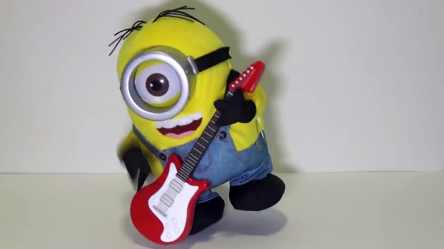 Minions Stuart Rock N Roll singing, playing his guitar and dancing