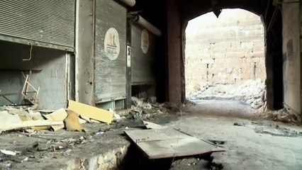 Fighter's tunnel found beneath shop debris in Aleppo