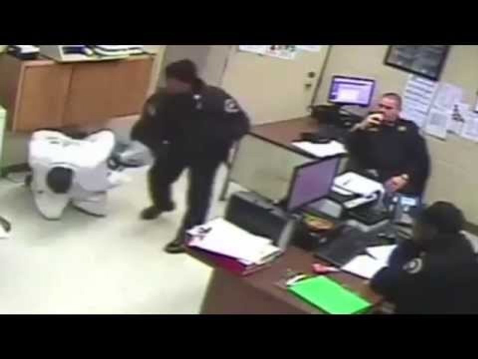 Watch as Officers Do Nothing While Their Colleague Beats a Handcuffed Prisoner