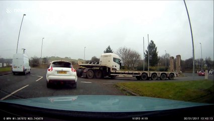 Lorry driver loses control on roundabout in Leeds, UK
