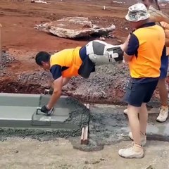 Construction Workers Play Wheelbarrow To Get The Job Done