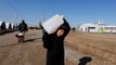 War-weary Mosul residents scramble for aid