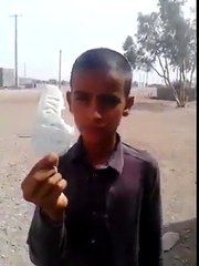 little boy hits target with stone through sling
