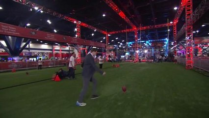 Peter Schrager tries to kick an extra point