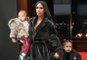 Kim Kardashian & North West Match In Dark Fur Coats Out In NYC