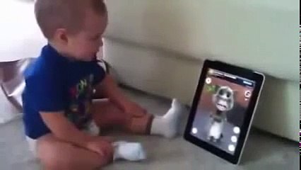 baby laughing funny with talking tom
