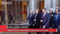 Merkel, Meclis’in bombalanan bölümlerini inceledi