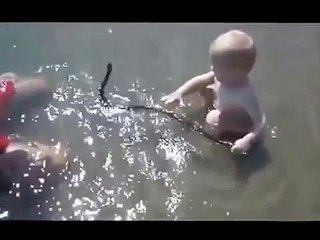 Russian Child Plays With Water Snake