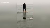 Man falls into frozen lake while ice skating