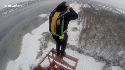 BASE jumpers take dangerous leap from top of electric pole