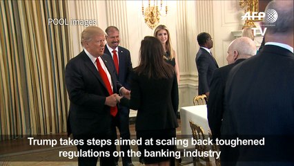 Trump moves to roll back financial regulation