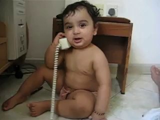 Cute baby has intense phone conversation