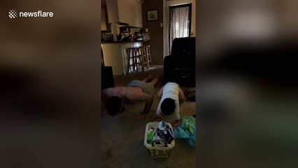 Dad teaches son how to do press-ups... fails
