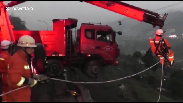 Firefighters rescue people trapped in lorry hanging off a cliff