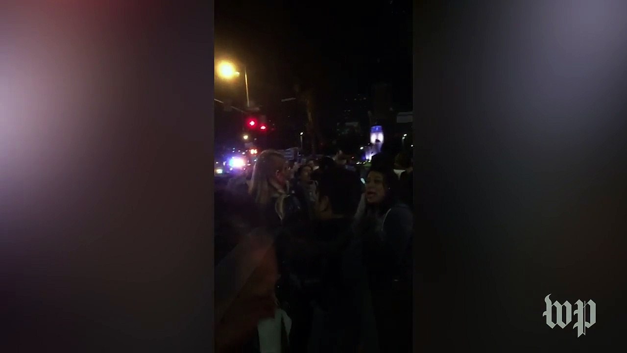 Immigration protesters block L.A. freeway ramp