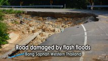 Road damaged by flash floods at Bang Saphan