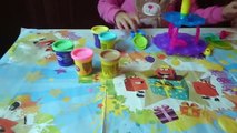 play doh 6-year-old kid doing figures tower of cupcakes