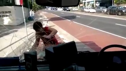 Crazy Man Attacking Bus in Sydney