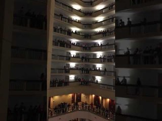 Floors of Singers Perform Haunting Version of American National Anthem