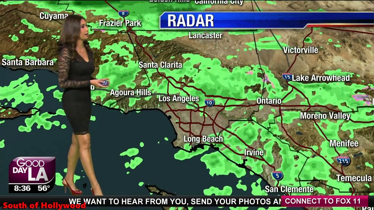 ia Quiban in a short tight black lace dress