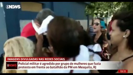 Coronel da PM sendo agredido por grupo de mulheres