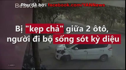 Bị "kẹp chả" giữa 2 ôtô, người đi bộ sống sót kỳ diệu (đã sửa)