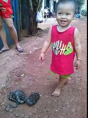 Baby Playing With Snake