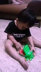 Sooo Crazy child..playing with Crocodile