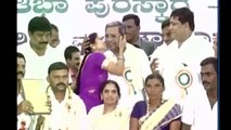 Woman kisses CM Siddaramaiah in Public Meeting.