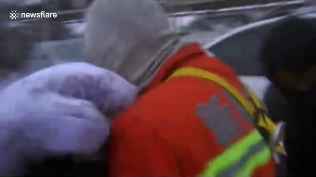 Emergency services rescue stranded motorists during China storm