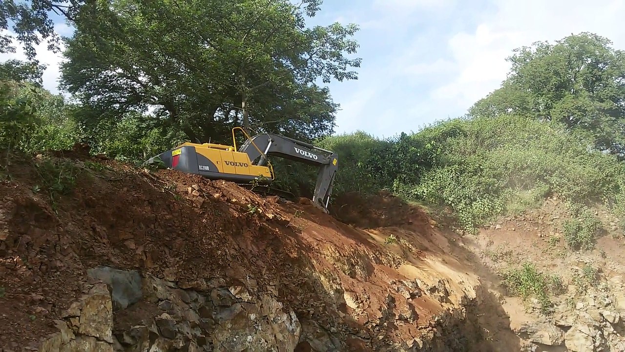 Volvo Ec210B Digging soil On the of Forest