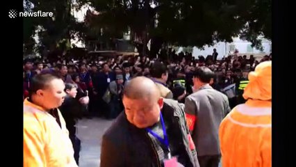 Man climbs sword ladder during village festivities