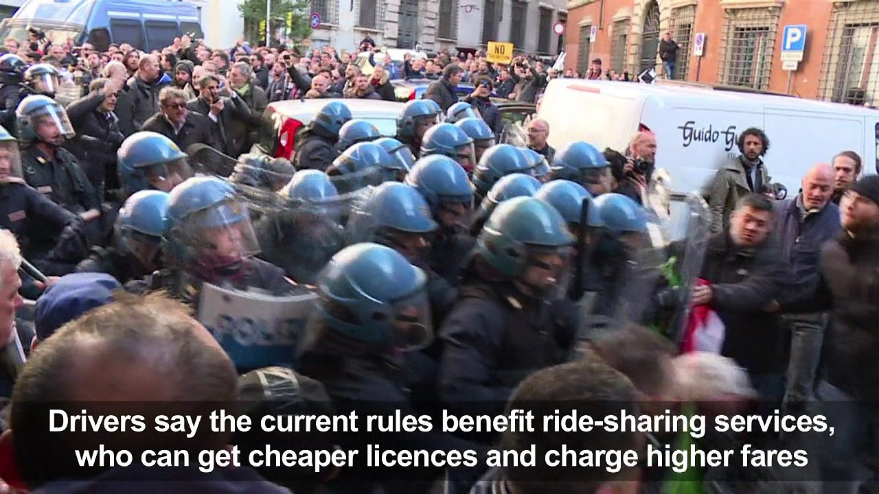 Italian taxi drivers clash with police during protest over Uber