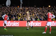 Semi-nude fan invades the pitch during Sutton's clash with Arsenal