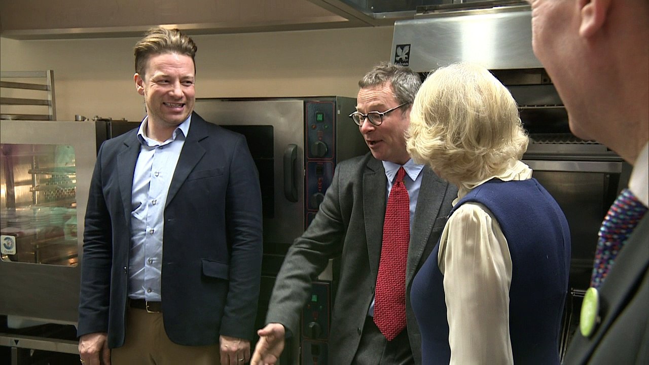 Camilla gets a baking lesson from Jamie Oliver