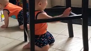 Baby stuck under chair comes up with genius idea