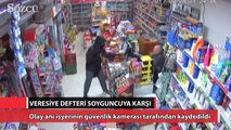 Silahlı soyguncuyu veresiye defteriyle kovaladı