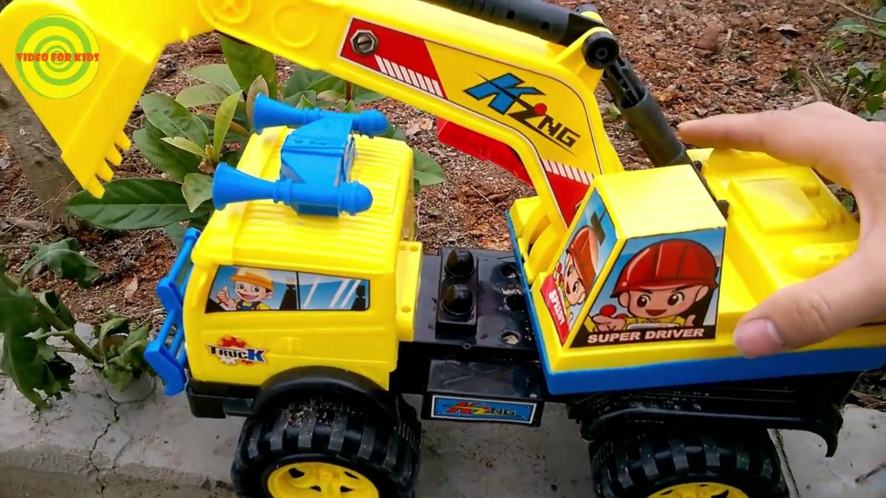 Excavators for kids _ Baby playing excavators destructive the yellow flowers   Toy for children-1jKxphS29VI