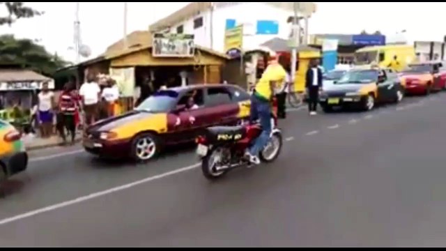 Crazy guy doing insane stunts on bike in street