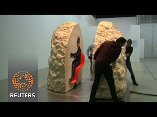 French artist emerges from seven days buried in rock