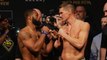 The UFC 209 main event steps on the scales for the fans at UFC 209 ceremonial weigh-ins