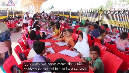 Volunteers Teach Homeless Children Under Bridge