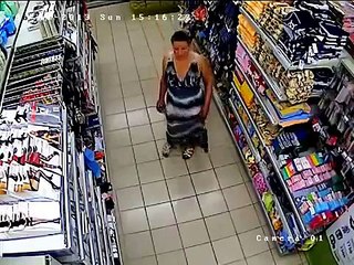 Arab woman stealing products in the supermarket