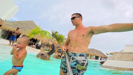 Maxim playing at kids waterpark in Cancun Mexico & having lots of fun on waterslides plays with toys