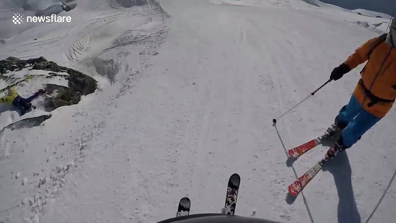 Skier spots friend stranded on the snow after checking his GoPro footage