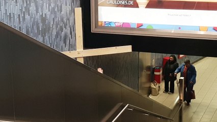 Jesus Carries His Cross in an Escalator